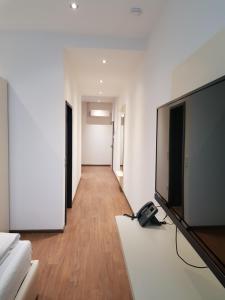 TV a/nebo společenská místnost v ubytování RheinCity Hotel & Boardinghouse