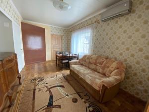 a living room with a couch and a table at Soliid Apartment in Pärnu