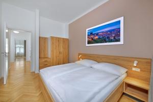 Cama o camas de una habitación en Downtown Suites Kodanska
