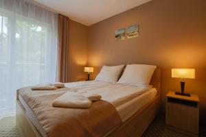 Posteľ alebo postele v izbe v ubytovaní Millennium Health Resort & Spa