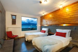 Ένα ή περισσότερα κρεβάτια σε δωμάτιο στο Hotel Altiplanico Puerto Natales