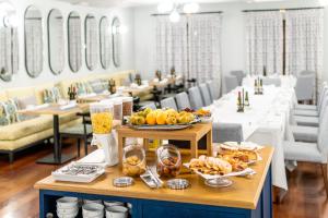 a table with food on it in a restaurant at Parador de El Hierro in Las Casas
