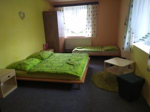 Кровать или кровати в номере Penzion Tomy1