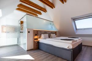 Postel nebo postele na pokoji v ubytování BinderS Budget City-Mountain Hotel + 37 fotografií