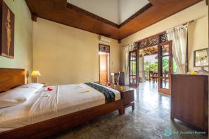 Ένα ή περισσότερα κρεβάτια σε δωμάτιο στο Treasure of Bali, 3BR villa, infinity pool, staff