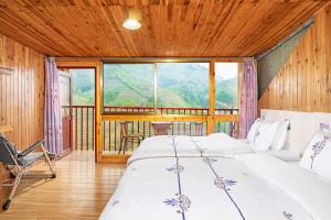 Letto o letti in una camera di 龙胜馨嘉源饭店