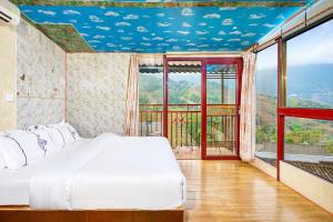 Letto o letti in una camera di 龙胜馨嘉源饭店