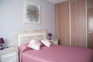 Posteľ alebo postele v izbe v ubytovaní Apartamentos EL POSAERO Juan Mariano