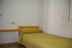 Posteľ alebo postele v izbe v ubytovaní Apartamentos EL POSAERO Juan Mariano