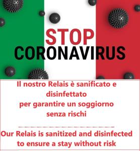 a poster for a stop coronavirus campaign at Locanda degli Antiquari in Rome