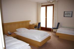 Postel nebo postele na pokoji v ubytování Hotel Herrenrest