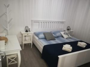 Łóżko lub łóżka w pokoju w obiekcie Apartment ANTONELLA