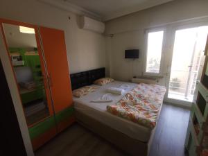 Postel nebo postele na pokoji v ubytování Çanakkale Kampüs Pansiyon