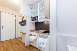 A kitchen or kitchenette at smartments Graz Még 6 kép