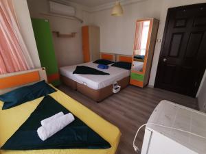 Postel nebo postele na pokoji v ubytování Çanakkale Kampüs Pansiyon