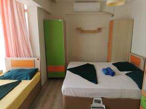 Postel nebo postele na pokoji v ubytování Çanakkale Kampüs Pansiyon
