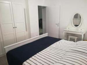 Łóżko lub łóżka w pokoju w obiekcie Apartment ANTONELLA