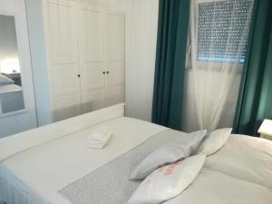 Łóżko lub łóżka w pokoju w obiekcie Apartment ANTONELLA