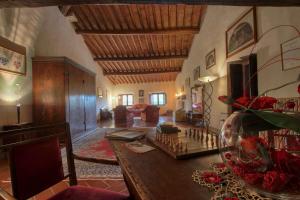 a living room with a table with a chess board at Villa Campestri Olive Oil Resort in Vicchio