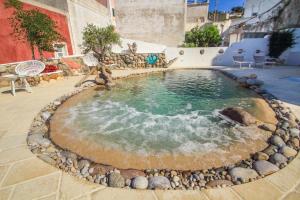 a small pool with a teddy bear sitting in it at Casa Pesce in Ponza