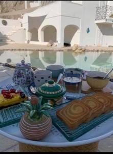 a table with a plate of food and drinks on it at Casa Pesce in Ponza