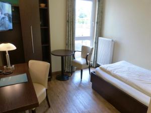 Postel nebo postele na pokoji v ubytování Hotel Evering