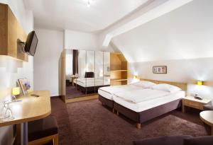 Postel nebo postele na pokoji v ubytování Hotel Jensen