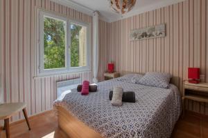 Een bed of bedden in een kamer bij Villa Cavalaire sur Mer