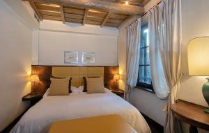 Un pat sau paturi într-o cameră la Locanda dello Spuntino