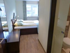 Postel nebo postele na pokoji v ubytování Hotel Evering