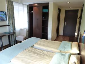 Postel nebo postele na pokoji v ubytování Hotel Evering