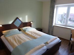 Postel nebo postele na pokoji v ubytování Hotel Evering