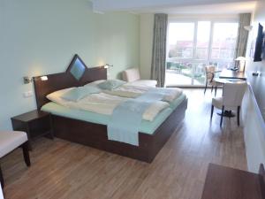 Postel nebo postele na pokoji v ubytování Hotel Evering