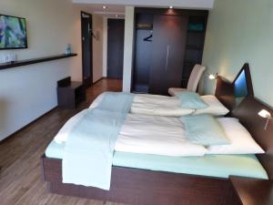 Postel nebo postele na pokoji v ubytování Hotel Evering