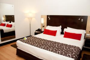 מיטה או מיטות בחדר ב-Hotel San Silvestre