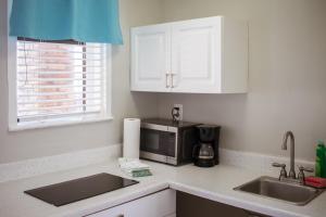 A kitchen or kitchenette at Riptide Oceanfront Hotel