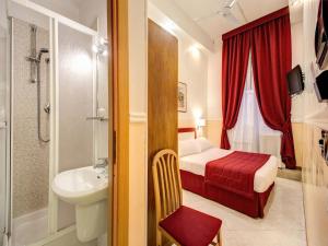 Postel nebo postele na pokoji v ubytování Hotel Giotto Flavia