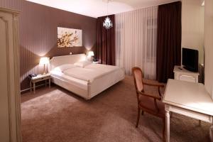 Postel nebo postele na pokoji v ubytování Hotel Jensen