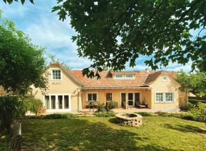 an exterior view of a house with a yard at The Nook - Balatonkiliti in Siófok