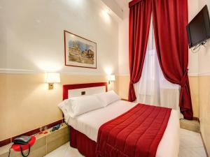 Postel nebo postele na pokoji v ubytování Hotel Giotto Flavia