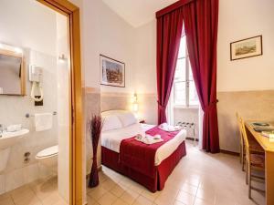 Postel nebo postele na pokoji v ubytování Hotel Giotto Flavia