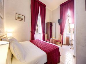 Postel nebo postele na pokoji v ubytování Hotel Giotto Flavia