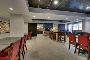 an empty dining room with tables and chairs at Holiday Inn Express - Horse Cave, an IHG Hotel in Horse Cave