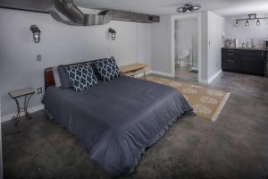 a bedroom with a large bed and a bathroom at Southeast Portland Retreat in Portland