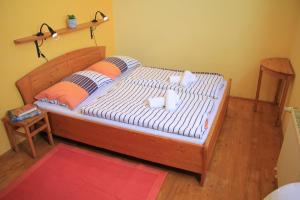Postel nebo postele na pokoji v ubytování Outline Centrum Jiřičná