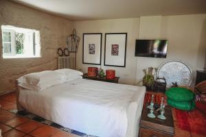 Postel nebo postele na pokoji v ubytování Casa do Xico