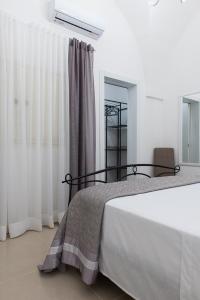 Postel nebo postele na pokoji v ubytování B.&.B Maison La Dama