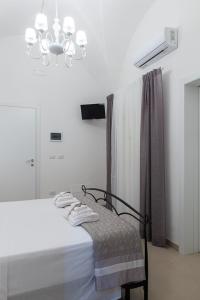 Postel nebo postele na pokoji v ubytování B.&.B Maison La Dama