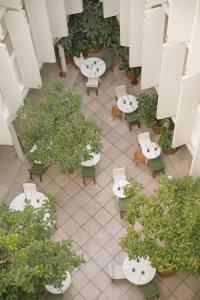 an overhead view of a patio with tables and potted plants at Condesa df, Mexico City, a Member of Design Hotels in Mexico City