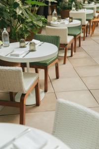 a row of tables and chairs in a restaurant at Condesa df, Mexico City, a Member of Design Hotels in Mexico City